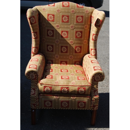 380 - Wing back armchair with loose cushion seat, raised on reeded square legs united by stretchers, 91cm ... 