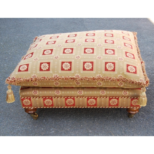 381 - Large contemporary ottoman footstool with loose cushion, raised on tapering turned legs terminating ... 