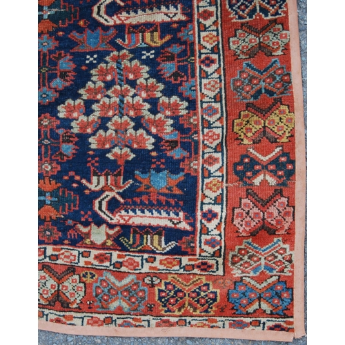 383 - Turkish runner with two rows of floral diamonds, blue ground, red and floral border, 395cm x 95cm.