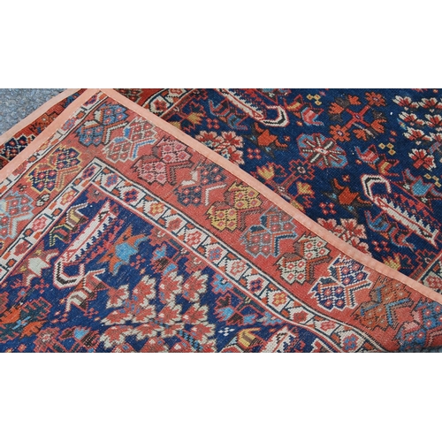 383 - Turkish runner with two rows of floral diamonds, blue ground, red and floral border, 395cm x 95cm.