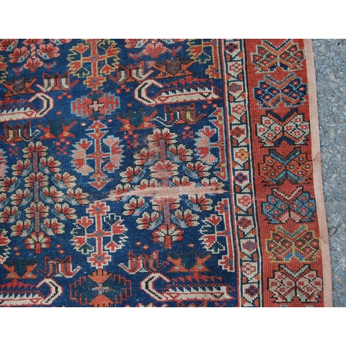 383 - Turkish runner with two rows of floral diamonds, blue ground, red and floral border, 395cm x 95cm.