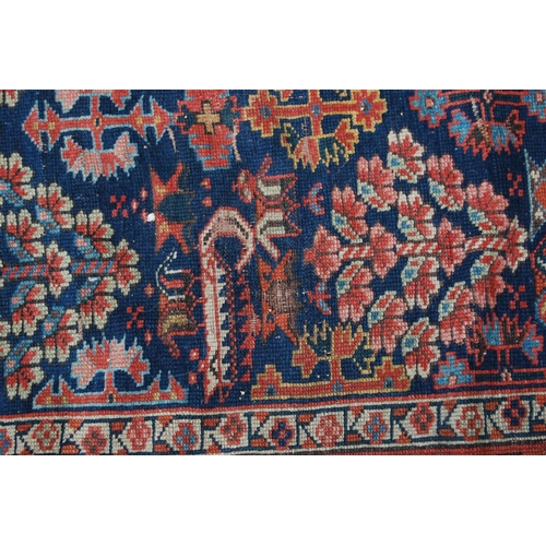 383 - Turkish runner with two rows of floral diamonds, blue ground, red and floral border, 395cm x 95cm.