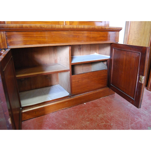 384 - Victorian mahogany bookcase cabinet, the projected cornice over glazed doors enclosing shelves, flan... 