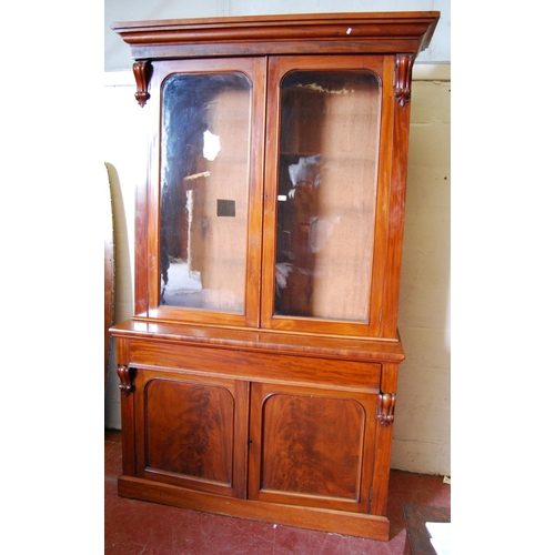 384 - Victorian mahogany bookcase cabinet, the projected cornice over glazed doors enclosing shelves, flan... 