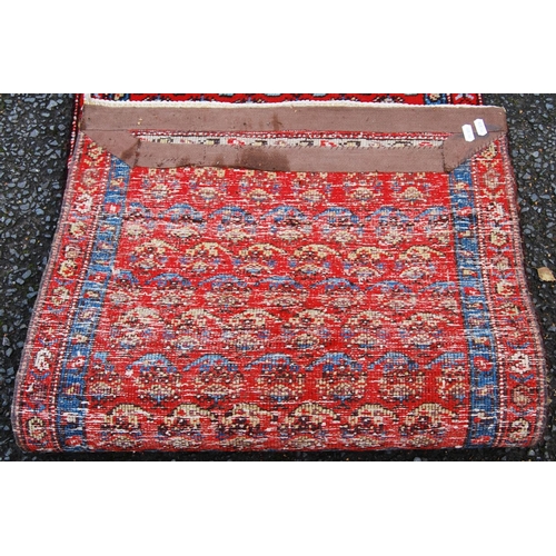 391 - Mir Serabend rug with all over floral boteh design over red ground and double border, 154cm x 58cm.