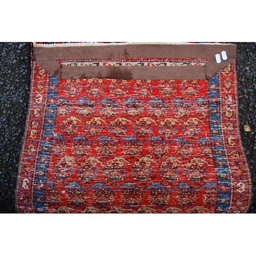 391 - Mir Serabend rug with all over floral boteh design over red ground and double border, 154cm x 58cm.