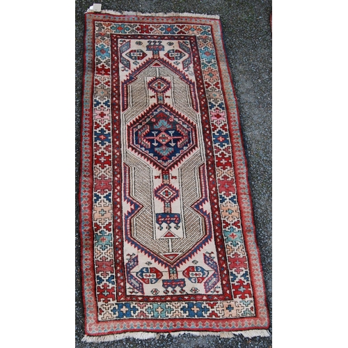 394 - Kurdish rug with central medallion, geometric design over cream ground and cruciform border, 175cm x... 