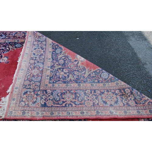 396 - Persian style carpet with central medallion over red ground, spandrels and foliate border, 303cm x 4... 