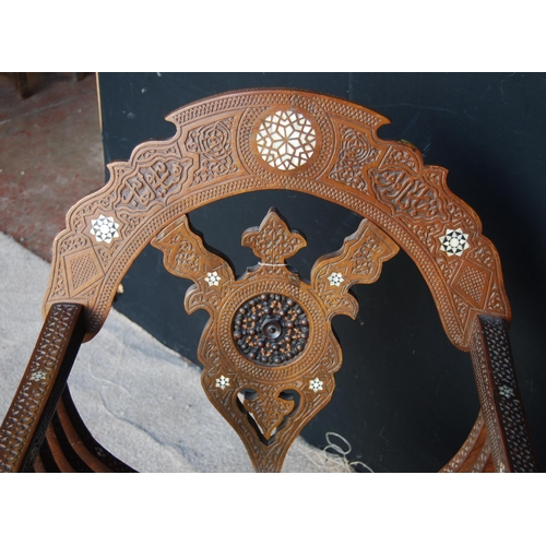 397 - Late Victorian Syrian Savonarola chair, the elaborate carved back with turned centre, the whole inla... 