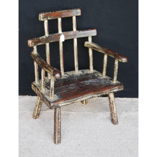 398 - Primitive Welsh style stick back chair, the stepped top rail over serpentine arms and solid seat, ra... 