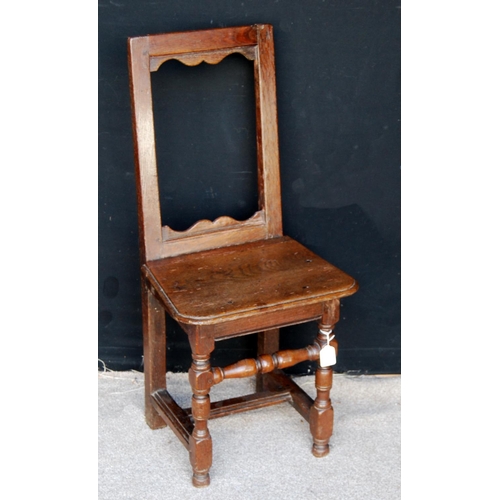 399 - Early 18th century oak high back joint chair, the open back over moulded seat and raised on block an... 