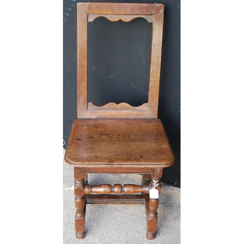 399 - Early 18th century oak high back joint chair, the open back over moulded seat and raised on block an... 