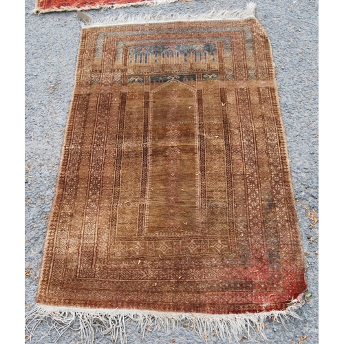 402 - Prayer mat with triple mihrab panel over mihrab, group border, faded red ground, 137cm x 68cm.