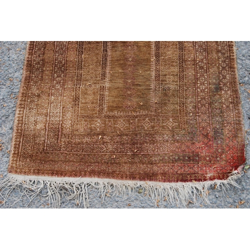 402 - Prayer mat with triple mihrab panel over mihrab, group border, faded red ground, 137cm x 68cm.