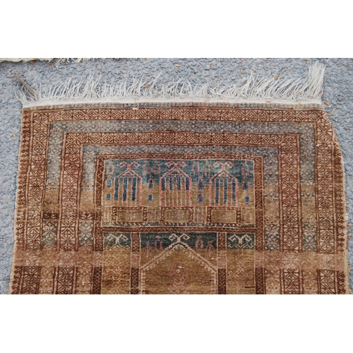 402 - Prayer mat with triple mihrab panel over mihrab, group border, faded red ground, 137cm x 68cm.