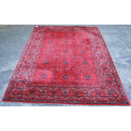 405 - Royal Keshan carpet with floral design over red ground and border, 366cm x 274cm.