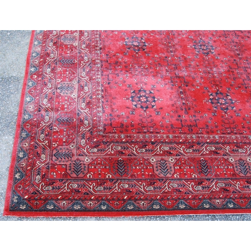 405 - Royal Keshan carpet with floral design over red ground and border, 366cm x 274cm.