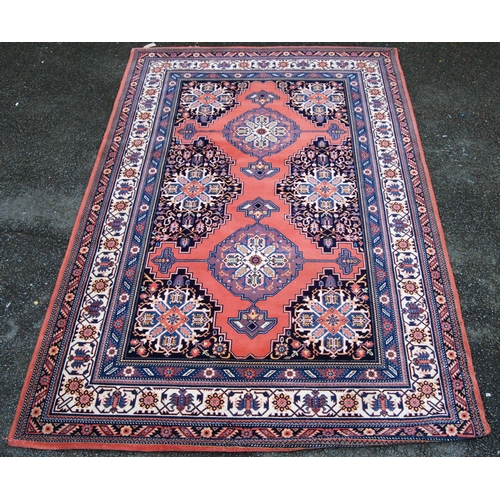 406 - Persian style carpet with two medallions over pink ground, spandrels and triple border, 297cm x 200c... 