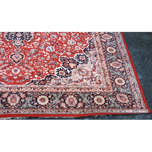 406 - Persian style carpet with two medallions over pink ground, spandrels and triple border, 297cm x 200c... 