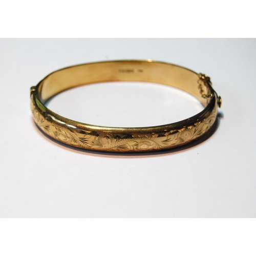 61 - 9ct gold hinged bangle, half-engraved, 13g.