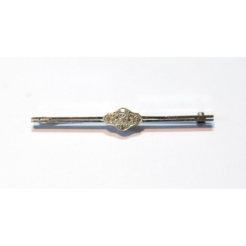 72 - Diamond bar brooch with shaped oval cluster, '18ct Plat', 3.2g.