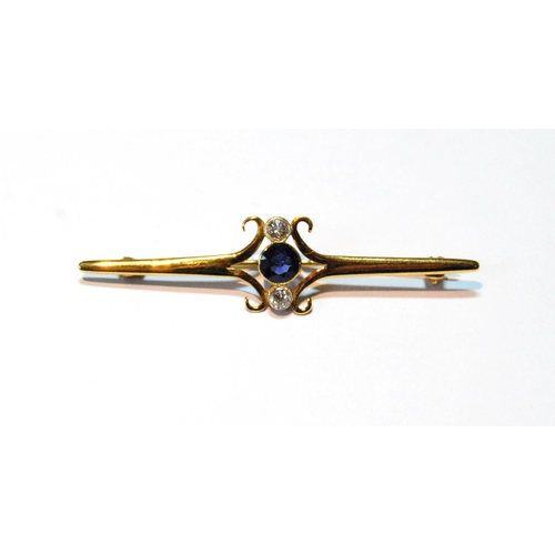 73 - Gold bar brooch with synthetic sapphire and two diamond brilliants, collet-set, probably 18ct gold.