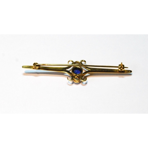 73 - Gold bar brooch with synthetic sapphire and two diamond brilliants, collet-set, probably 18ct gold.