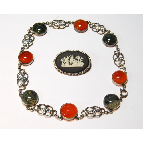 78 - Silver mounted agate and carnelian necklace and a Wedgwood brooch.   (2)