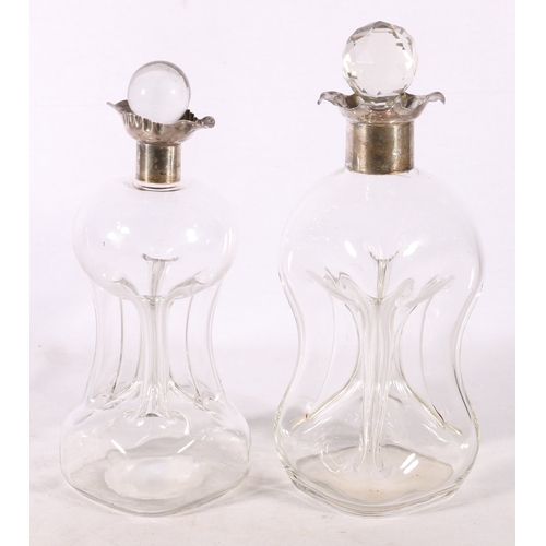 57 - Two Victorian silver mounted decanters of waisted hour glass form, one collar by Hukin & He... 