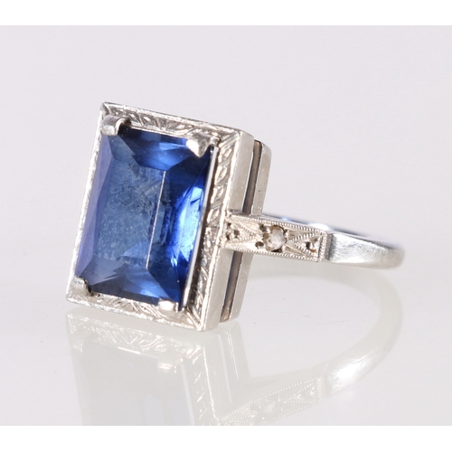 74 - Palladium Art Deco style dress ring set with central blue faceted baguette stone, makers marks AWC&a... 