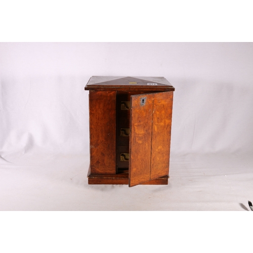 311 - 19th century oak apprentice's type table top cabinet chest with peaked top, the doors opening to rev... 