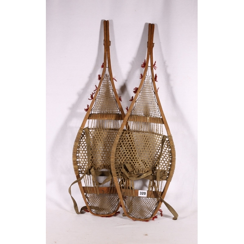 320 - Pair of vintage snow shoes with walrus gut stringing, 74cm long