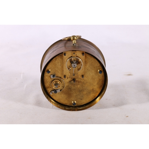 329 - Brass bulk head clock with white enamelled dial having Roman numerals, 10cm diameter