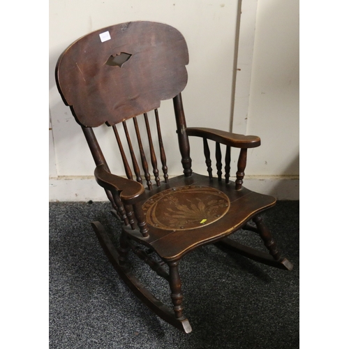 351 - Arts and Crafts child's rocking chair with scroll arms and pokerwork seat, 68cm tall