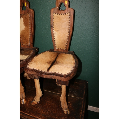 364 - Pair of taxidermy and rosewood stools, the legs formed form deer legs and upholstered in deer skin, ... 