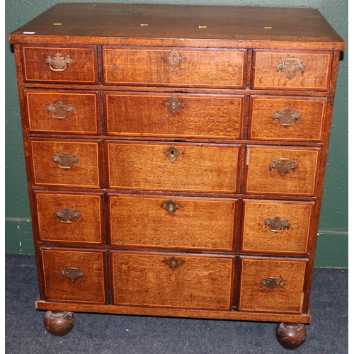 387 - Antique oak and string inlaid chest of drawers, the rectangular top above five graduated long drawer... 