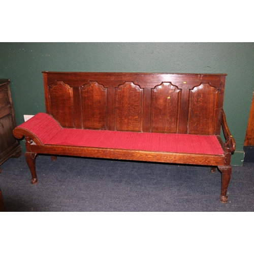 388 - Antique oak settle day bed with quintuple panel back, slip in seat and scroll arms raised on cabriol... 