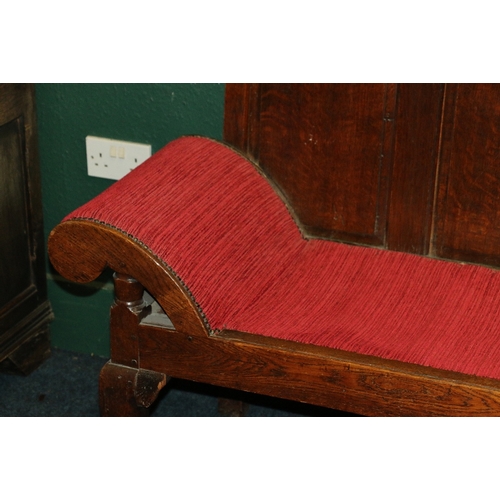 388 - Antique oak settle day bed with quintuple panel back, slip in seat and scroll arms raised on cabriol... 