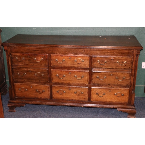 389 - Antique oak sideboard, the crossbanded top with moulded edge above an arrangement of cupboards and d... 