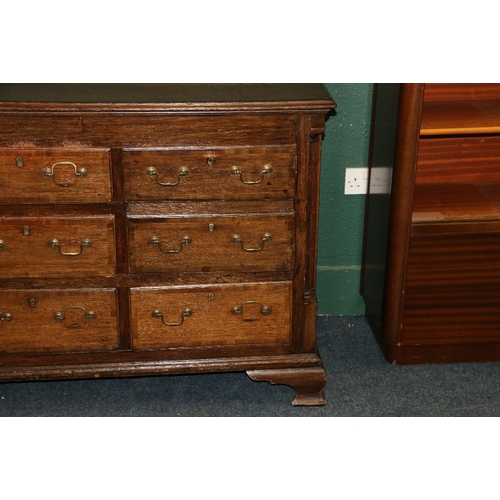 389 - Antique oak sideboard, the crossbanded top with moulded edge above an arrangement of cupboards and d... 