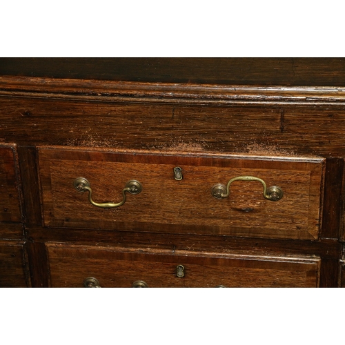 389 - Antique oak sideboard, the crossbanded top with moulded edge above an arrangement of cupboards and d... 