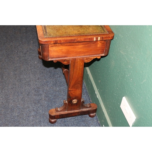 390 - Victorian rosewood desk, the pop up top with inset leather skivers raised one trestle base united by... 