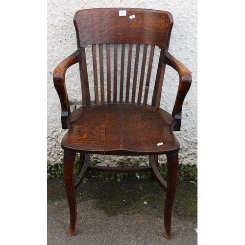 395 - 19th century oak desk chair with spar back, scroll arms, saddled seat and raised on cabriole support... 