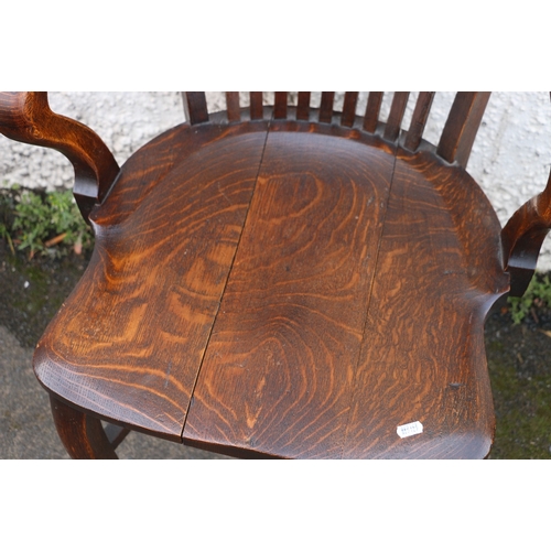 395 - 19th century oak desk chair with spar back, scroll arms, saddled seat and raised on cabriole support... 