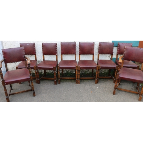 396 - Set of eight oak panel back dining chairs including two carvers raised on turned supports