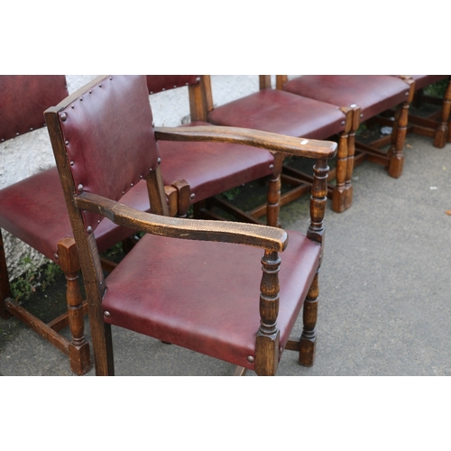 396 - Set of eight oak panel back dining chairs including two carvers raised on turned supports