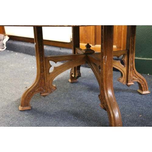 398 - Arts and Crafts Puginesque oak centre or library table with octagonal top, the base with carved and ... 