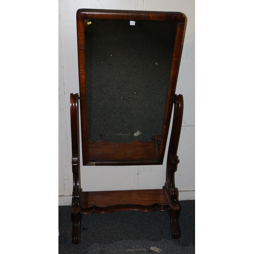 401 - Victorian mahogany cheval mirror with scroll and tulip supports raised on castors, 166cm tall