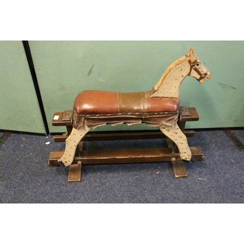 451 - 20th century rocking horse with white painted detailing on trestle base, 92cm long 