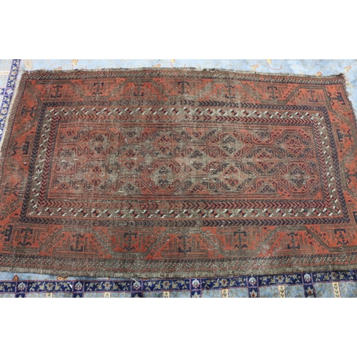 462 - A Eastern rug, central diamond over brown ground geometric border, 198 x 111cm